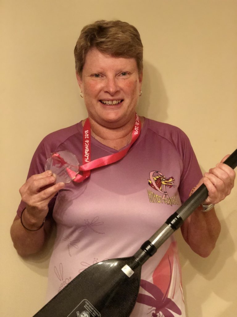 Geri with her paddle and winning medal