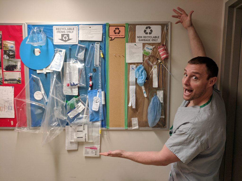 Lucas Murphy, a nurse who helps with the OR recycling efforts with the educational recycling bulletin board 