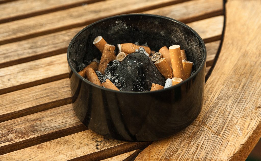 Ashtray with cigarette buds