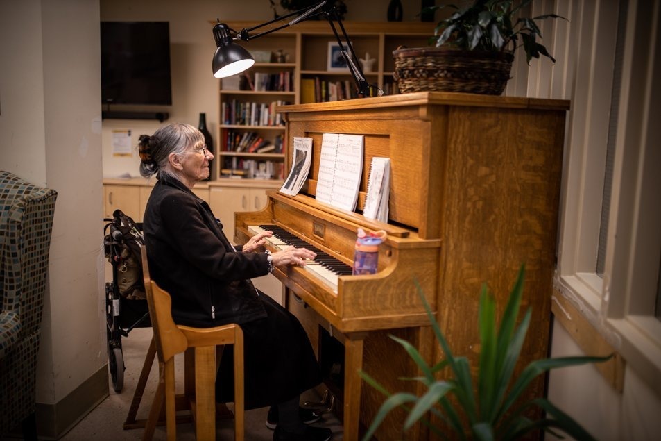 Madeline playing piano as part of the therapeutic recreation programming for patients 