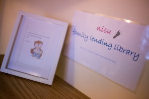 A sign advertises a free lending library in an NICU