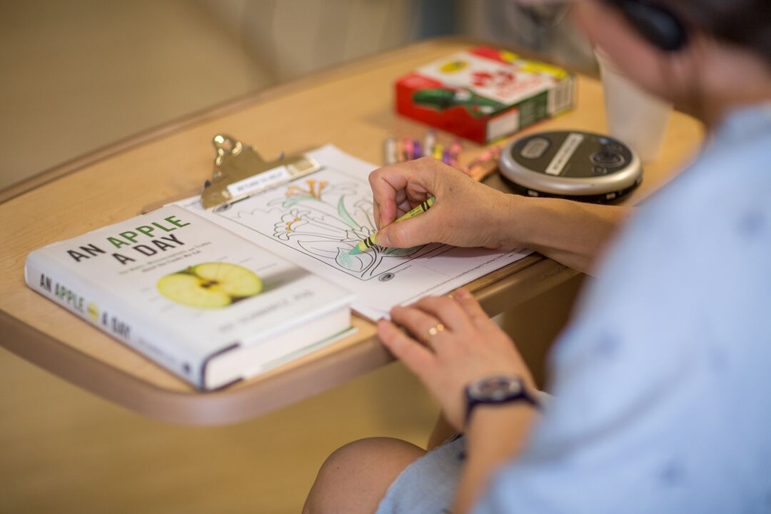 a patient with delirium uses a colouring book