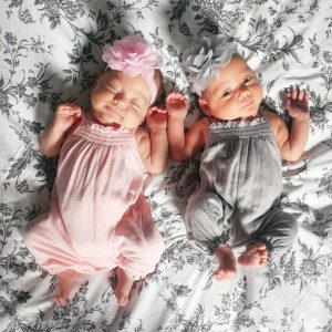 Healthy newborn Mono Mono twins are dressed up