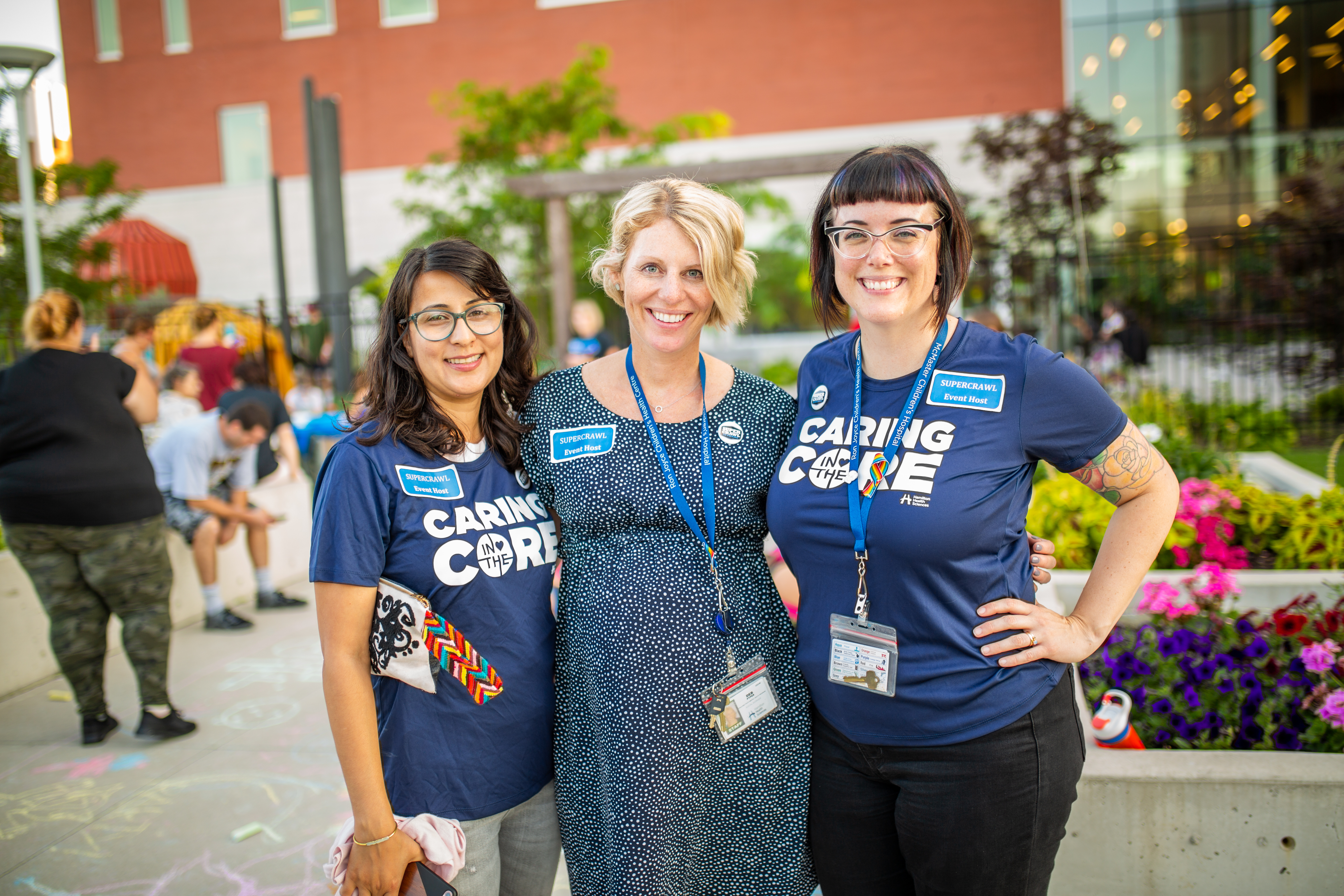 Three RJCHC staff members smile for the camera