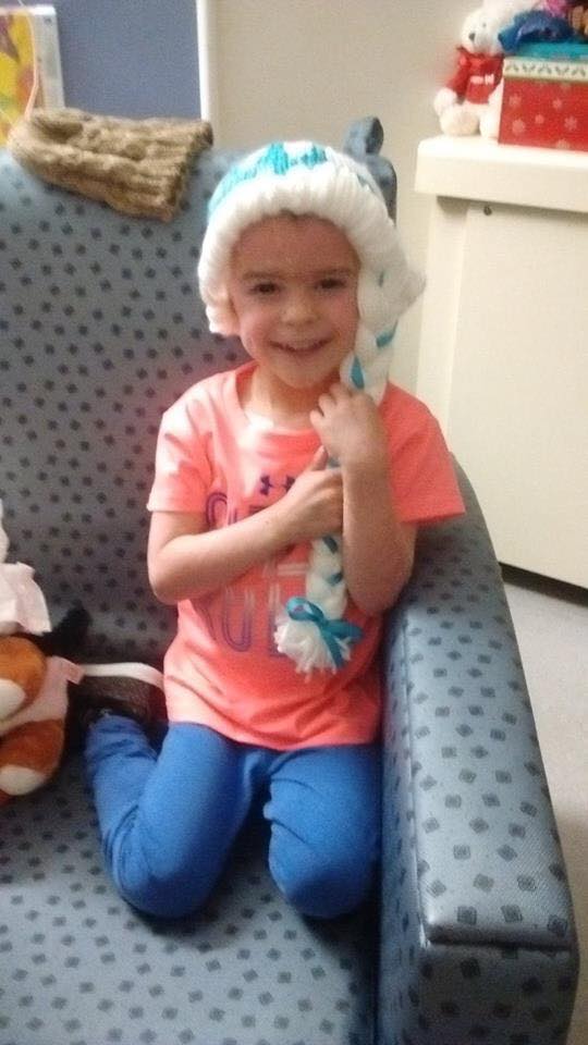 a young girl in the hospital wearing a while Elsa wig