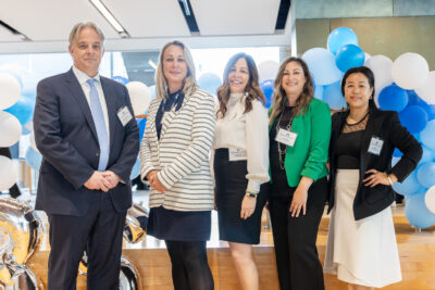 Group photo of Dr. Marc Jeschke, HHS vice president of research and chief scientific officer; Tracey MacArthur, HHS president and CEO; Katie Porter, director of research administration; Lauren Gogo, XXX; and Andrea Lee, XXX. with blue balloons in the background.